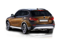 BMW X1 E84 2009–2015 Rostfri list ovanför registreringsskylten foto 1