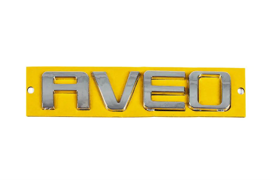 Chevrolet Aveo T300 2011–2020 AVEO textemblem 96462533 (115 mm x 23 mm) Image