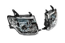Mitsubishi Pajero Wagon IV 2006–2021 OEM-framstrålkastare (2 st) foto 2