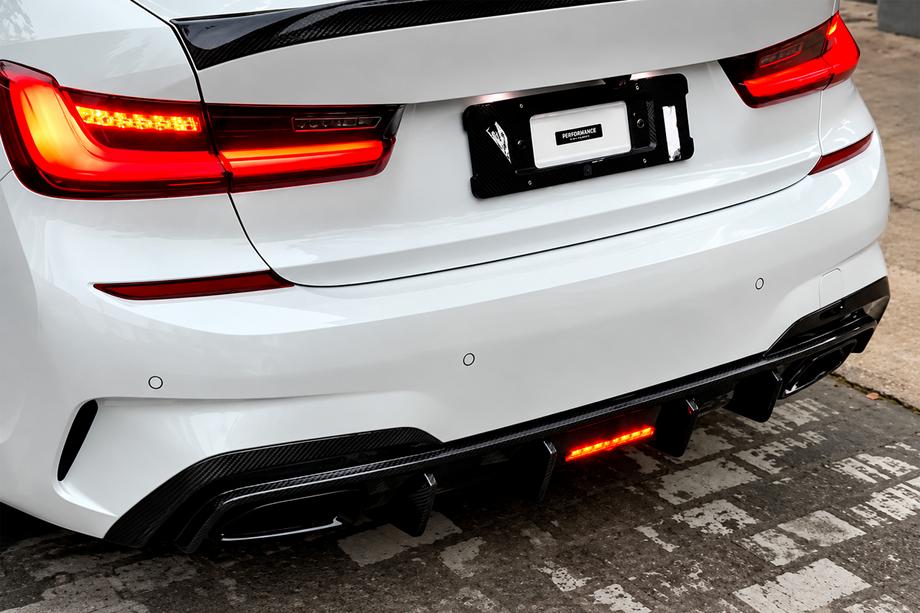 BMW 3-serien G20/G21 2018– Bakre stötfångardiffusor V6 (för M-Sport 2018-2022, kolfiber) Foto 1