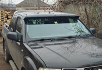 Nissan Navara 2006–2015 Solskydd till vindrutan (på ram) foto 1