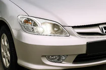 Honda Civic Sedan VII 2001–2006 Strålkastaröverdrag (2 st, plast) foto 1