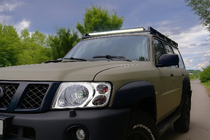 Nissan Patrol Y61 1997–2011 Kromade strålkastarkåpor (2001-2004, 2 st.) foto 1