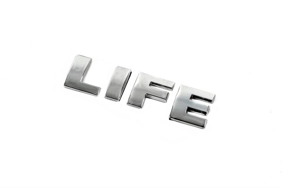 Volkswagen Caddy 2004–2010 Textemblem "Life" (OEM-utförande) Image