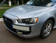 Mitsubishi Lancer X 2008– Registreringsskylthållare (plast) foto 1