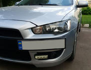 Mitsubishi Lancer X 2008– Registreringsskylthållare (plast) foto 2