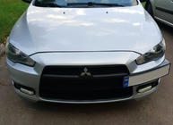 Mitsubishi Lancer X 2008– Registreringsskylthållare (plast) foto 4