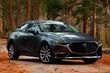 Fjärde generationen av den kompakta sedanen Mazda 3 foto 1