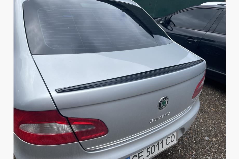 Skoda Superb 2009–2015 LIP-spoiler (Sunplex, svart) (115,8 cm x 6,3 cm) Image